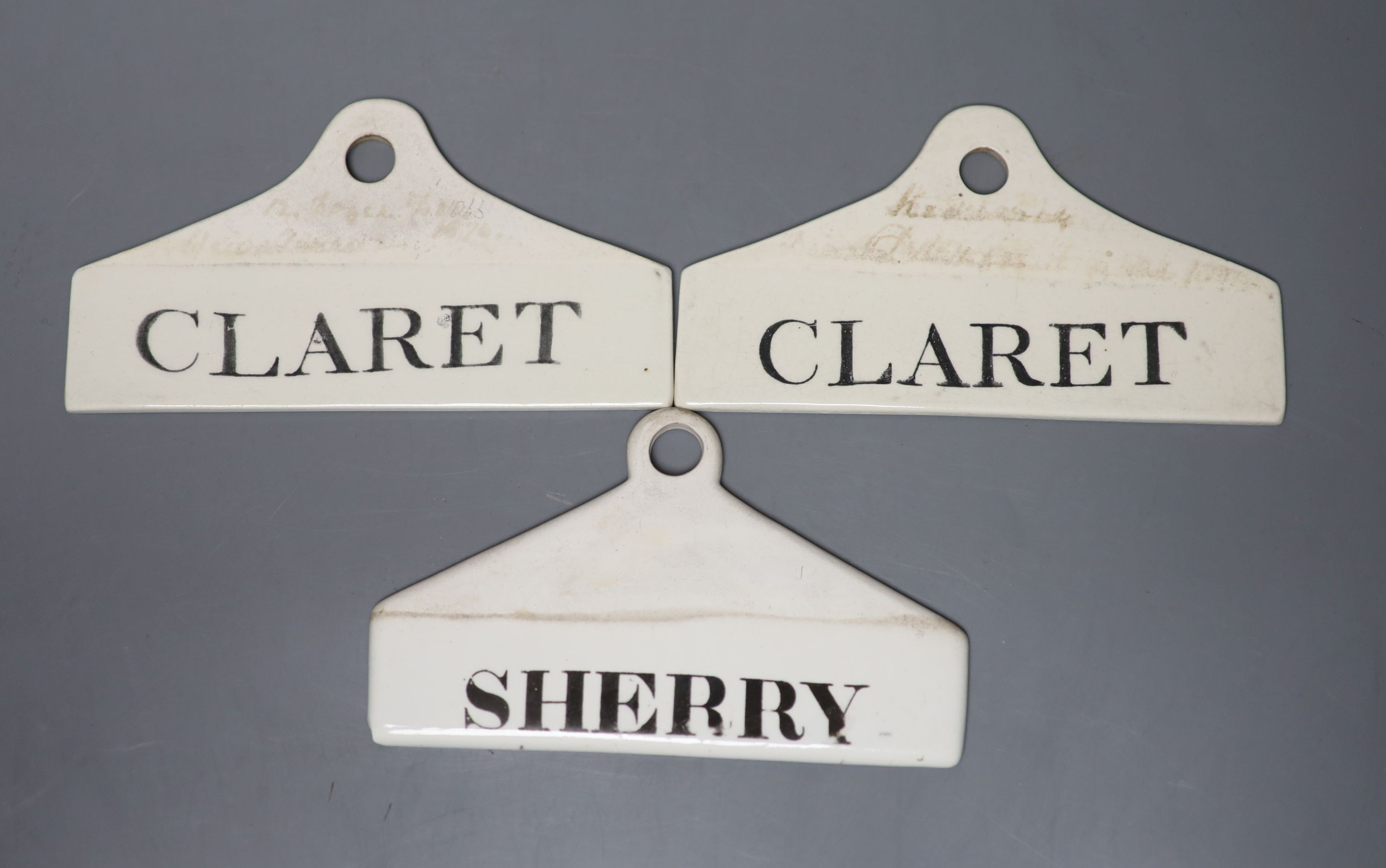 Two early 19th century Wedgewood creamware bin labels ‘claret’, 14.5cm and another creamware ‘sherry’ label